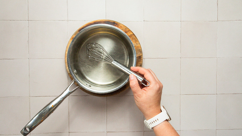 Whisking simple syrup in saucepan