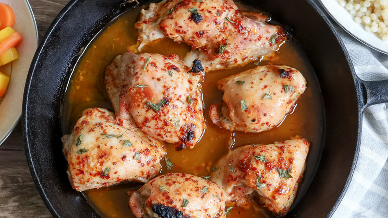 cooked chicken thighs in pan