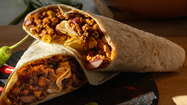 Chili and burritos close-up.