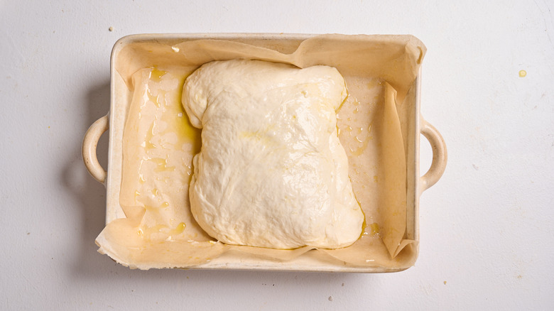 focaccia dough in a baking dish