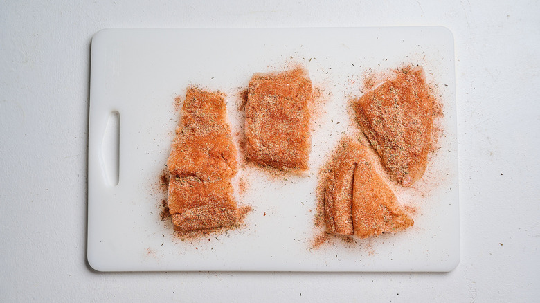 Fish coated in a seasoning blend