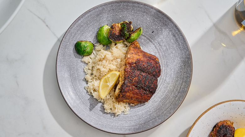 Grouper filet on a plate with rice