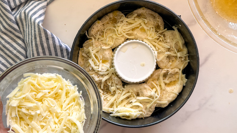 adding cheese to pan
