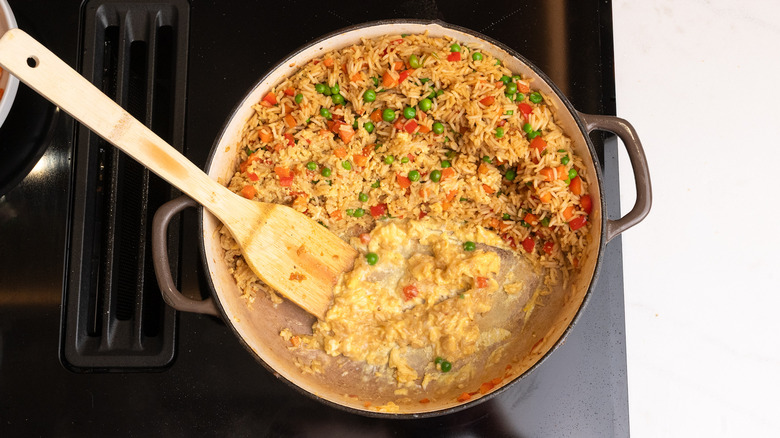 scrambling eggs in rice pan