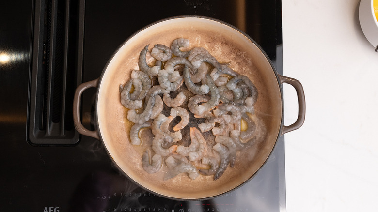 shrimp in pan on hob