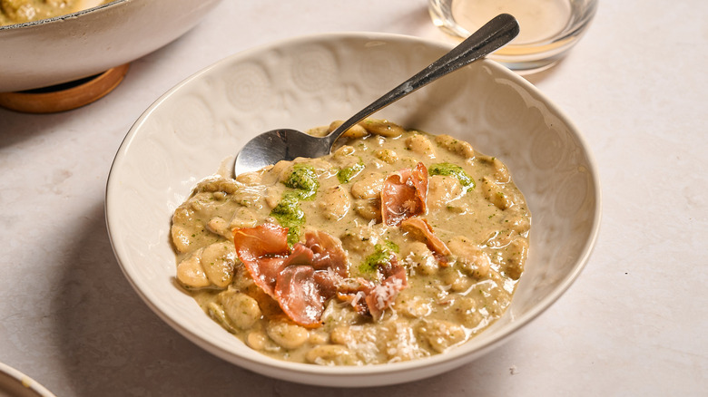 pesto beans in a bowl on a table