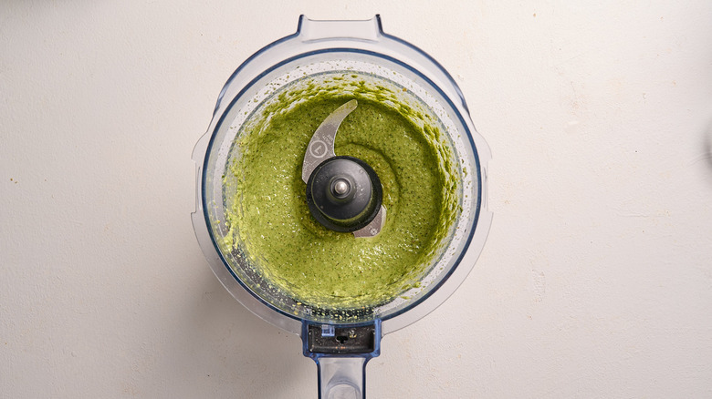 oil blended into pesto in food processor