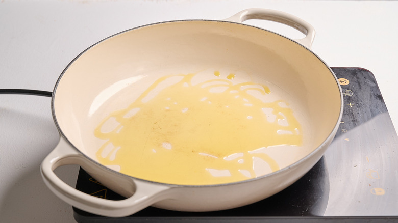 heating oil in a skillet
