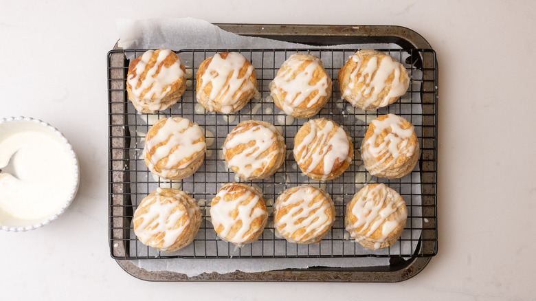 glazed cinnamon biscuits on wire rack
