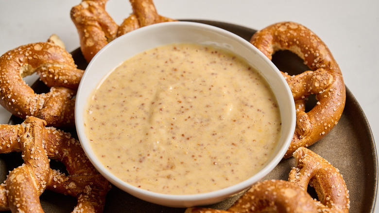 honey mustard in a bowl with pretzels