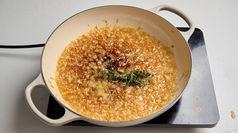 sugar dissolved and darkened over onions in a skillet