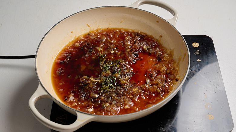 white balsamic added to skillet with sugar and onions