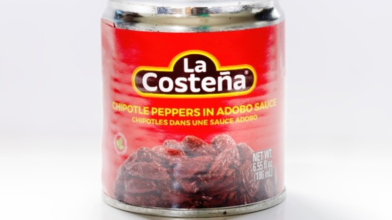 A close-up of the red label of a can of La Costeña Chipotles Peppers in Adobo Sauce.