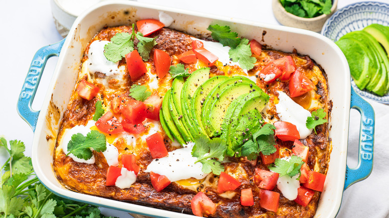 Easy tortilla breakfast casserole with toppings.