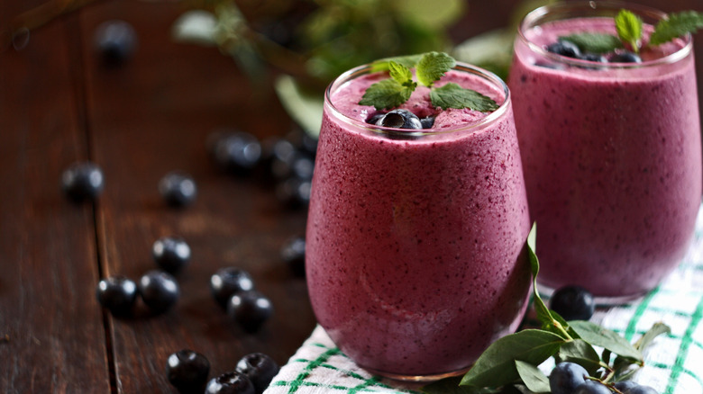 Two glasses of blueberry smoothie
