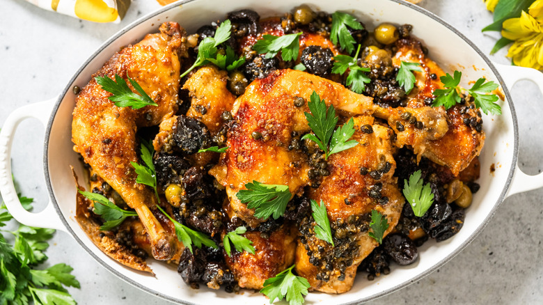 Chicken Marbella in casserole dish