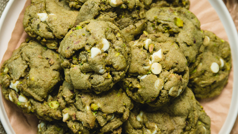 Close up on white chocolate matcha cookies on white plate