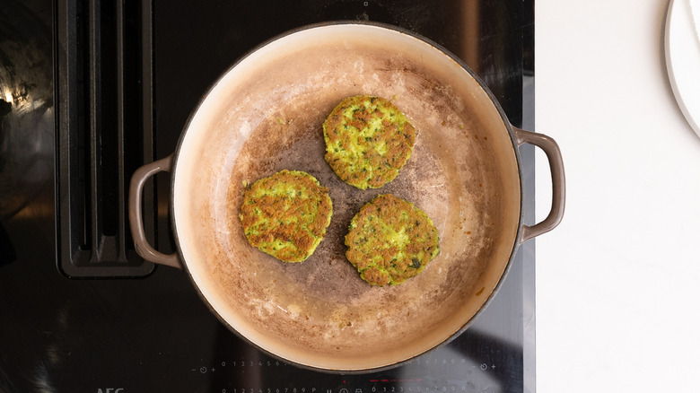 edamame fritters cooking in pan
