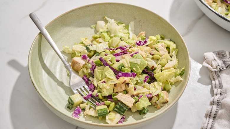 Edamame salad on a plate with a fork