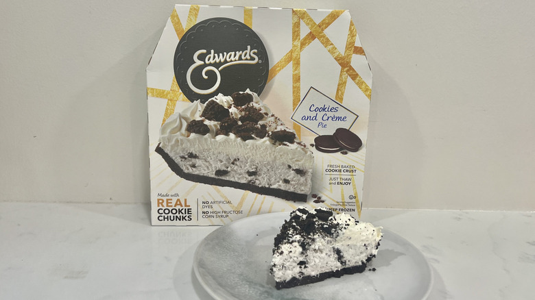 Edwards cookies and crème pie slice on a plate in front of the package