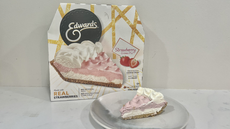 Edwards strawberry crème pie slice on a plate in front of the package