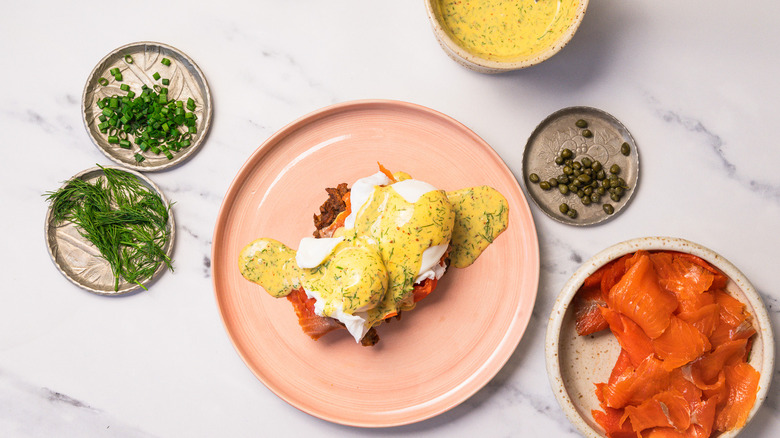 Plate rosti with smoked salmon, eggs, and sauce