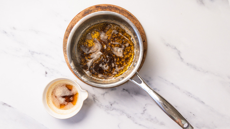 Brown butter for hollandaise in pan.