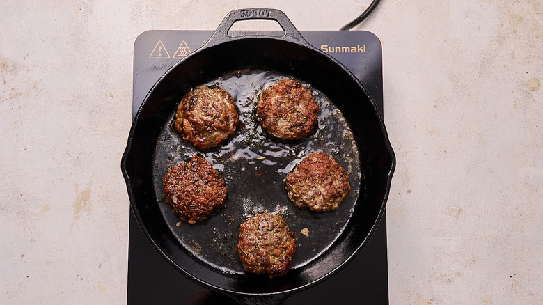 browning sausage patties in a skillet