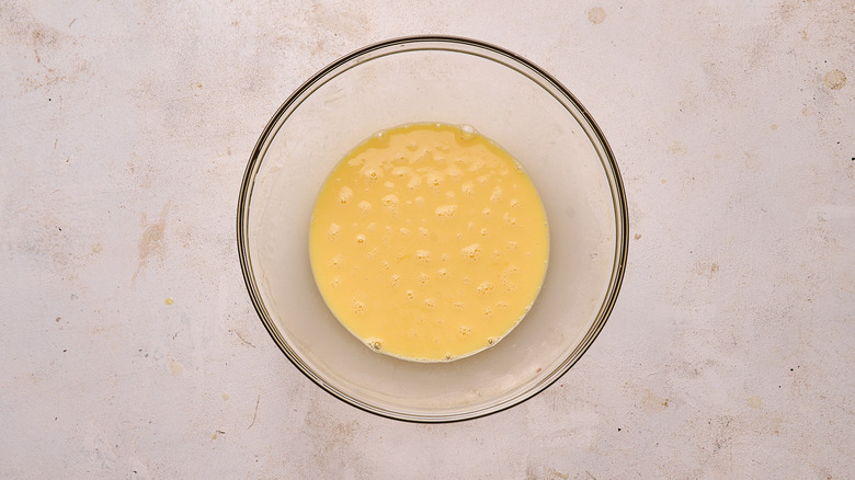 eggs and cream mixed together in bowl