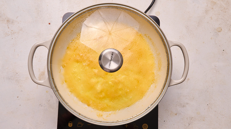 steaming egg in a skillet