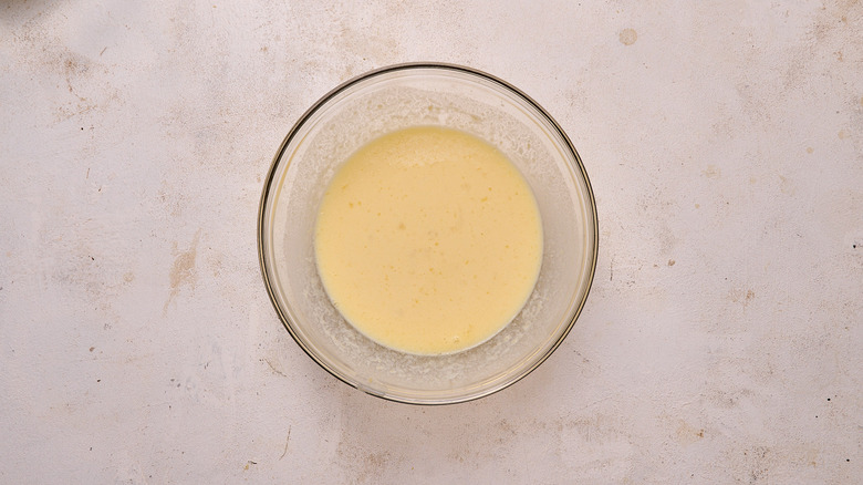 Egg and milk mixture combined in bowl