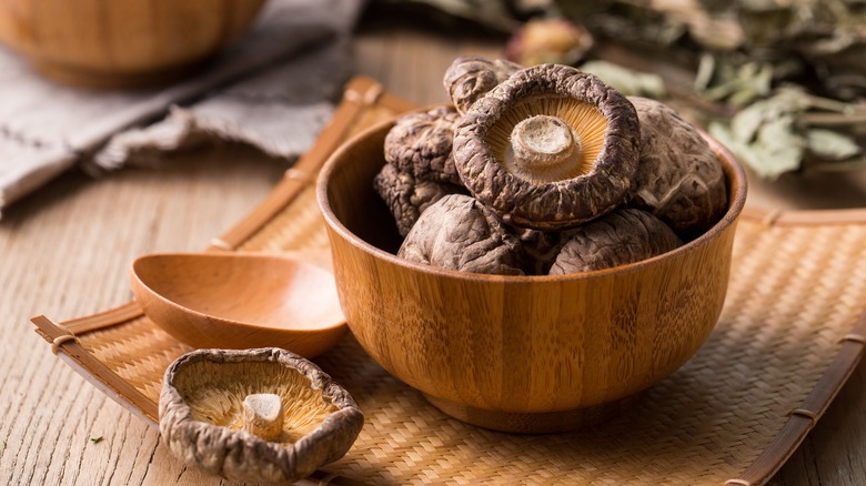 Dried mushroom in wooden bowl