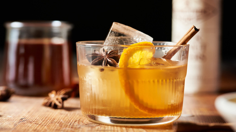 A glass of chai-infused old fashioned cocktail