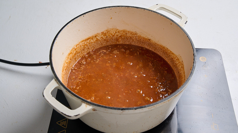 simmering chili ingredients in a dutch oven