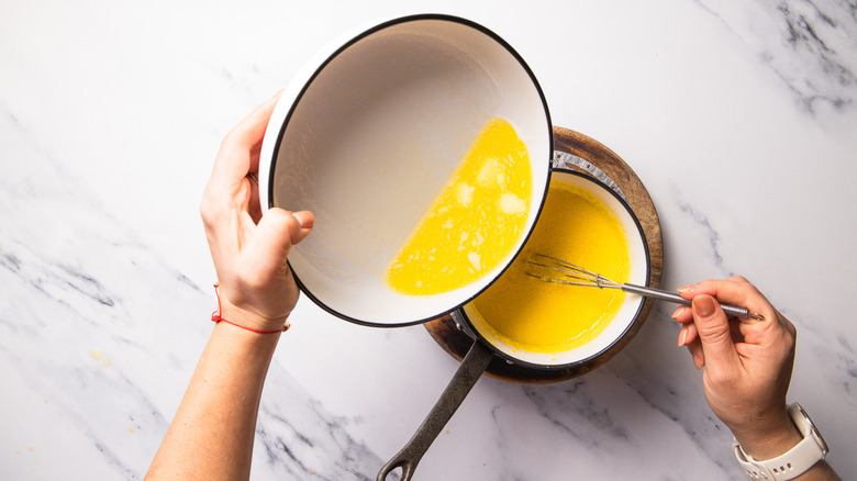 Adding melted butter to hollandaise