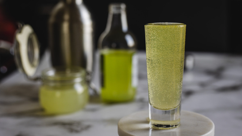 green drink in shot glass 