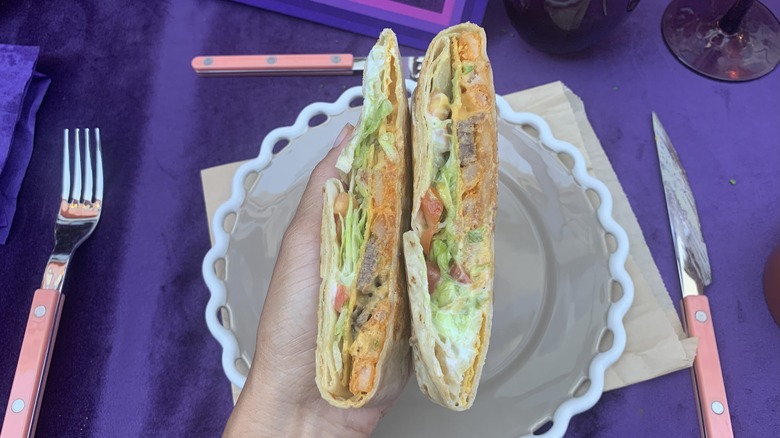 Two halves of California Crunchwrap showing filling