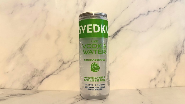 Can of Svedka Lime Vodka Water on marble surface