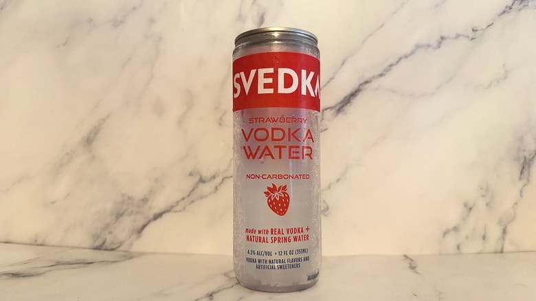 Can of Svedka Strawberry Vodka Water on marble surface