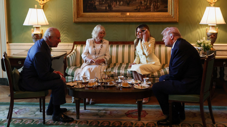 King Charles III, Queen Camilla, Melania Trump, and Donald Trump sitting down for tea