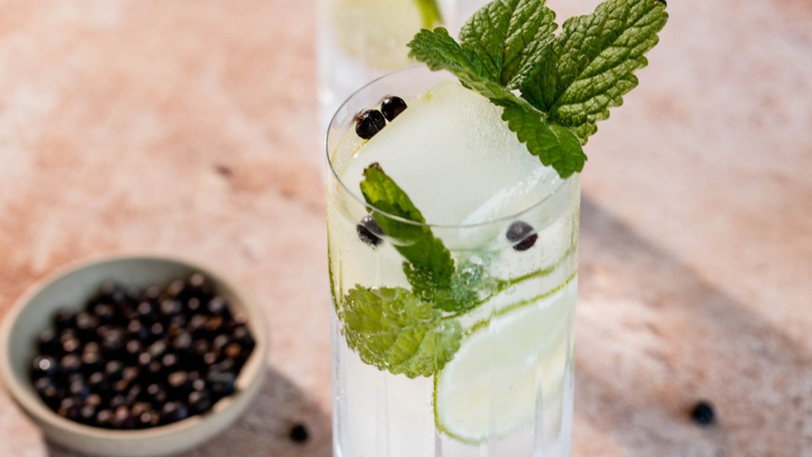 Enhance The Flavors Of Your Gin And Tonic With Juniper Berries And Lime