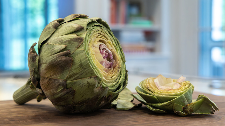 An artichoke flower with the top cut off to reveal layers.