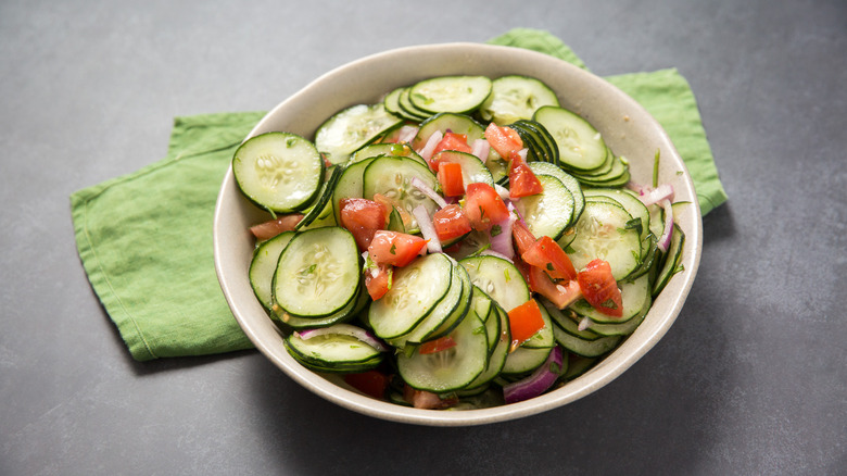 cucumber salad served on table