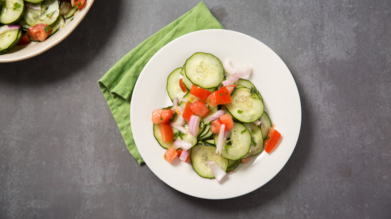cucumber salad served on table