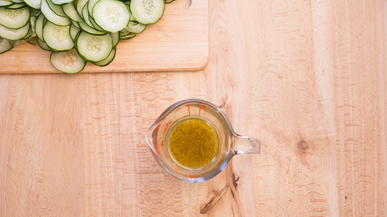 salad dressing in measuring cup