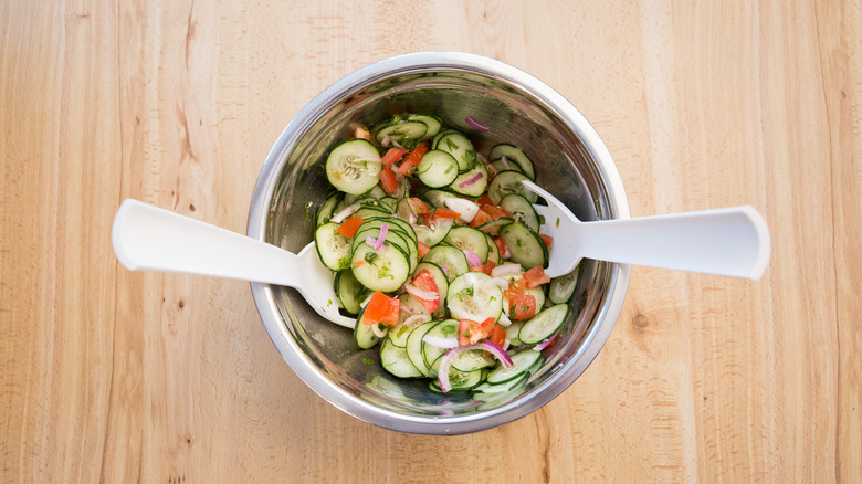 cucumber salad in mixing bowl
