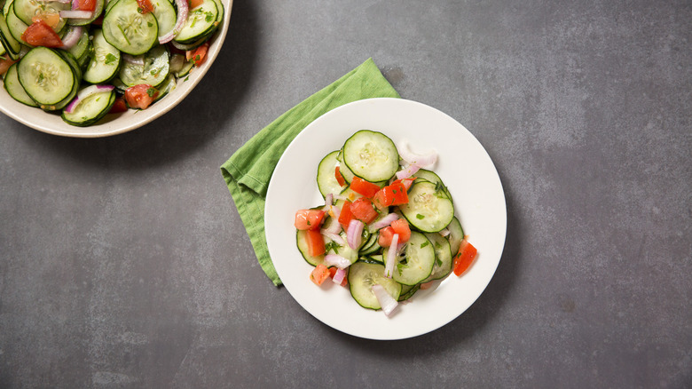 cucumber salad served on table