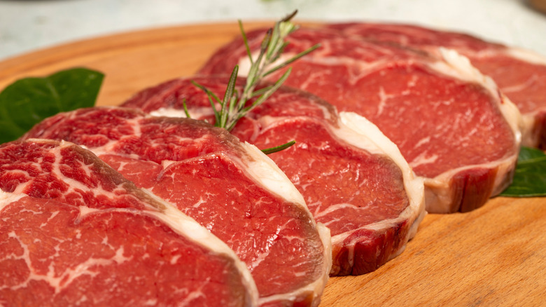 Raw beef ribeye entrecôte on stone background