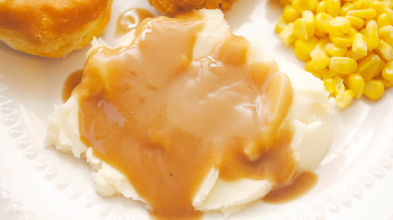 mashed potato with gravy and side of corn