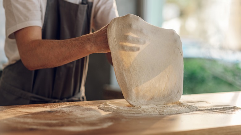 Man making pizza dough